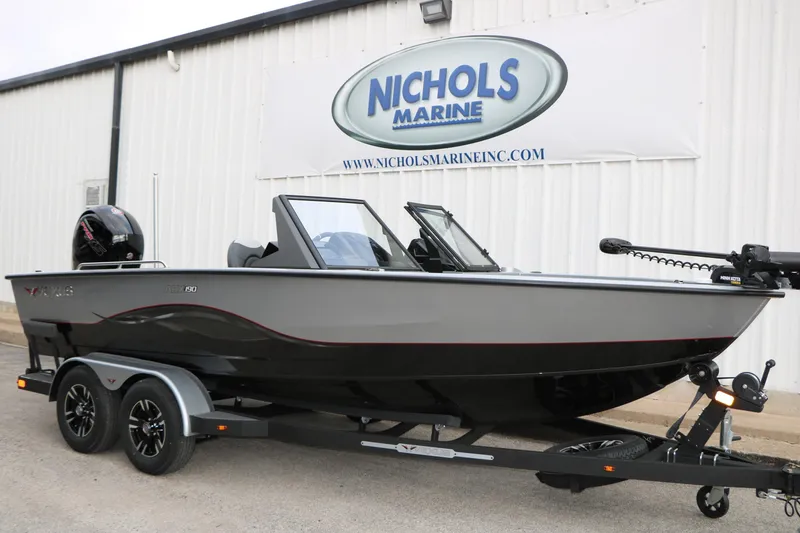 Slide: The Image of 2026 Vexus ADX 190 boat on trailer at Nichols Marine dealership. - 4