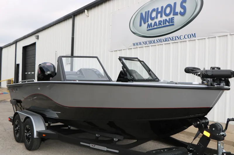Slide: The Image of 2026 Vexus ADX 190 boat on trailer at Nichols Marine dealership. - 6