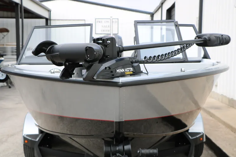 Slide: The Image of 2026 Vexus ADX 190 boat with Minn Kota Terrova trolling motor, parked outdoors. - 8