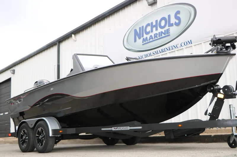 Slide: The Image of 2026 Vexus ADX 190 boat on trailer at Nichols Marine dealership. - 9