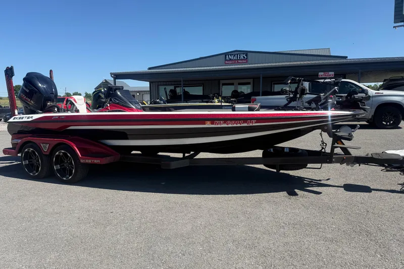 Slide: The Image of 2020 Skeeter FXR20 Limited boat on trailer, parked outside Anglers Outpost & Marine. - 3