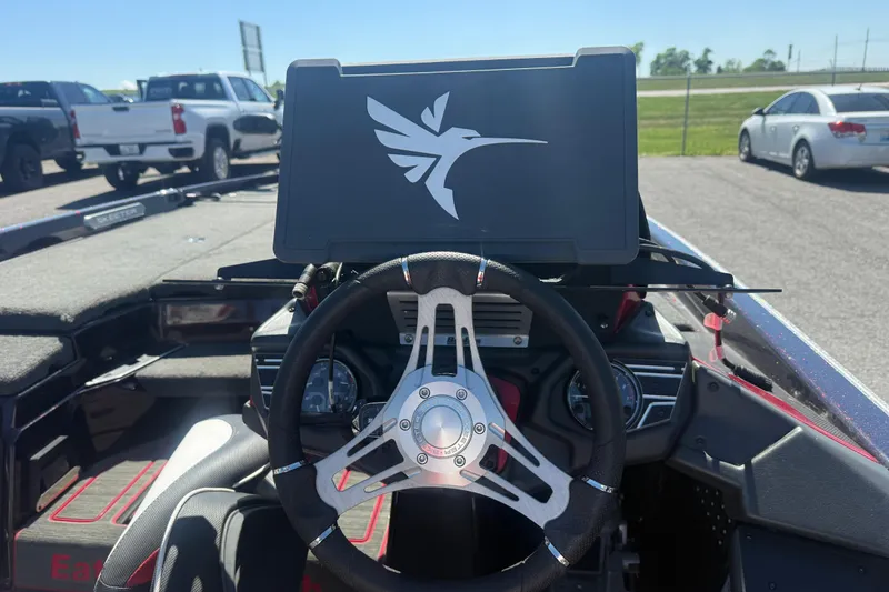 Slide: The Image of 2020 Skeeter FXR20 Limited boat dashboard with steering wheel and hummingbird logo. - 8