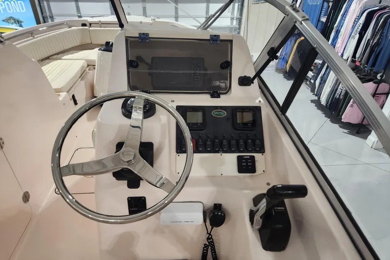 Slide: The Image of 2007 Grady-White Tournament 225 boat interior with storage compartment and seating. - 11