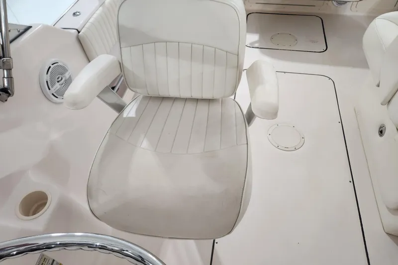 Slide: The Image of Storage compartment with rope on a 2007 Grady-White Tournament 225 boat. - 12