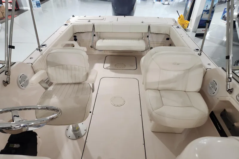 Slide: The Image of 2007 Grady-White Tournament 225 boat dashboard with steering wheel and control panel. - 13