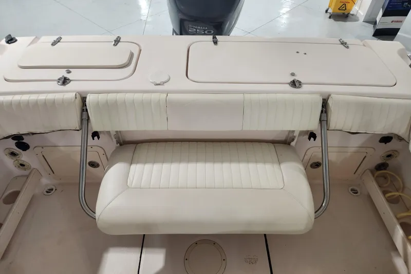 Slide: The Image of 2007 Grady-White Tournament 225 boat interior with seating and steering wheel. - 16