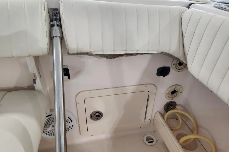 Slide: The Image of Red storage compartment inside a 2007 Grady-White Tournament 225 boat. - 19