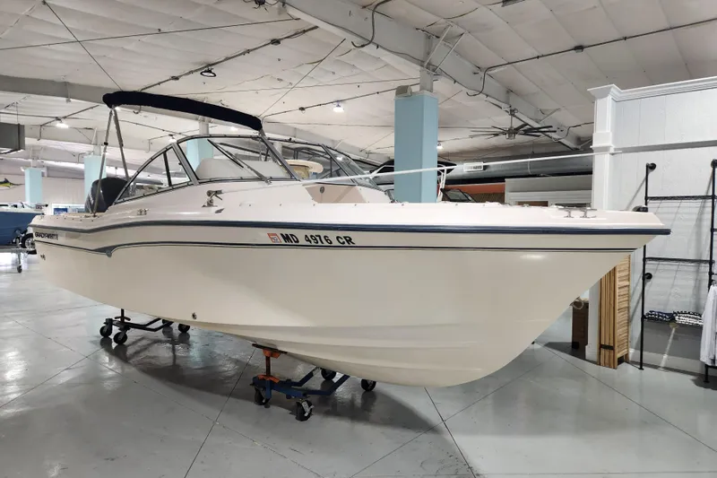 Slide: The Image of 2007 Grady-White Tournament 225 boat displayed indoors on a trailer. - 2