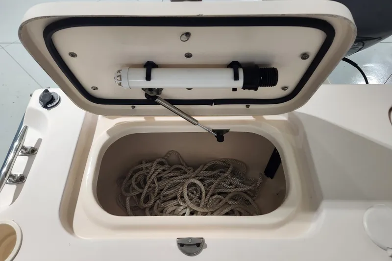 Slide: The Image of Interior view of a 2007 Grady-White Tournament 225 boat, showing seating and storage. - 24