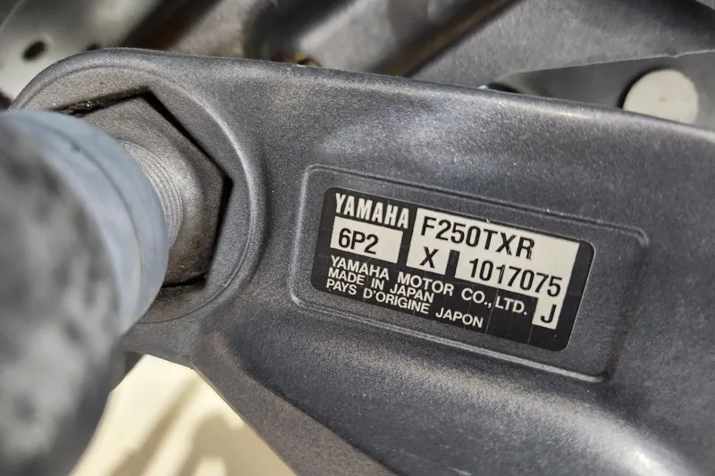 Slide: The Image of Open storage compartment with rope on a 2007 Grady-White Tournament 225 boat. - 26