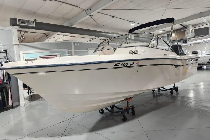 Slide: The Image of 2007 Grady-White Tournament 225 boat displayed indoors on a trailer. - 3