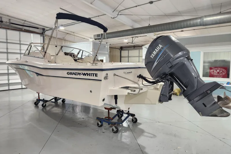 Slide: The Image of 2007 Grady-White Tournament 225 boat with Yamaha outboard motor in a showroom. - 5