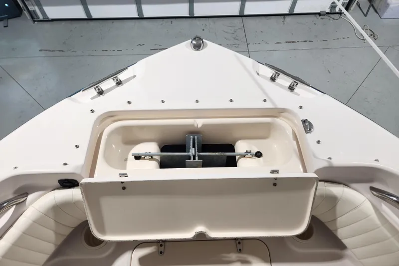 Slide: The Image of 2007 Grady-White Tournament 225 boat interior with storage compartments and seating. - 8