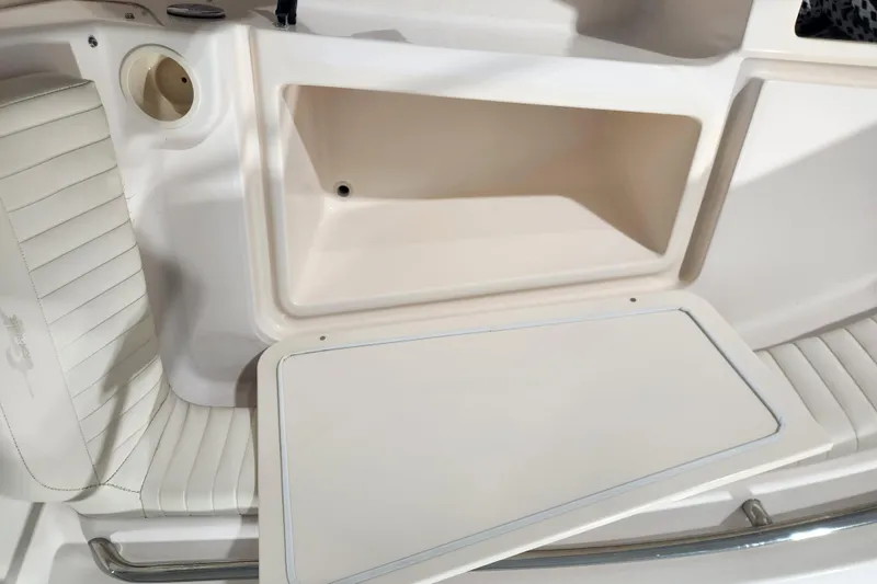 Slide: The Image of 2007 Grady-White Tournament 225 boat interior with storage compartments and seating. - 9
