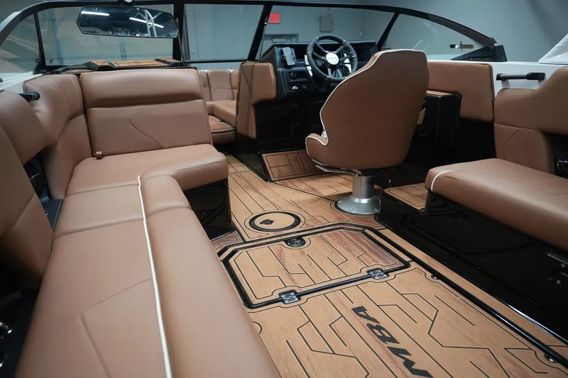 Slide: The Image of Interior of 2026 Moomba Tykon with brown leather seating. - 17