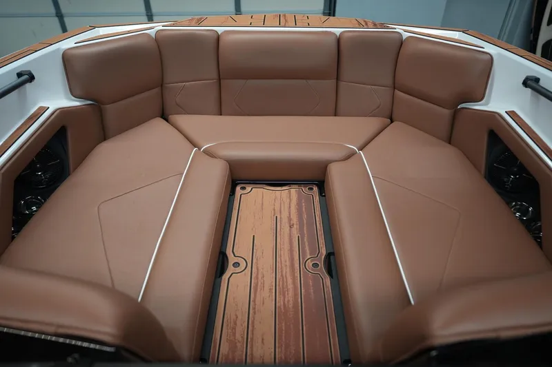 Slide: The Image of Interior of 2026 Moomba Tykon with brown leather seating. - 19