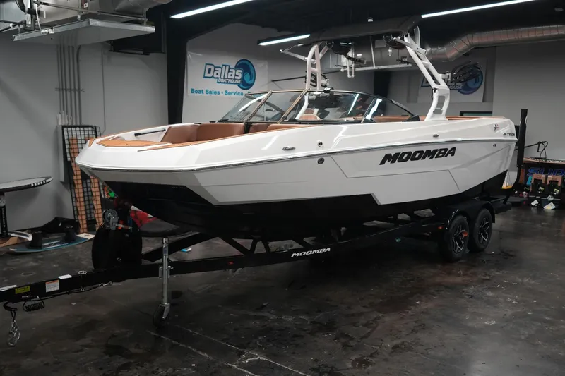 Slide: The Image of 2026 Moomba Tykon boat in a workshop on a trailer. - 3