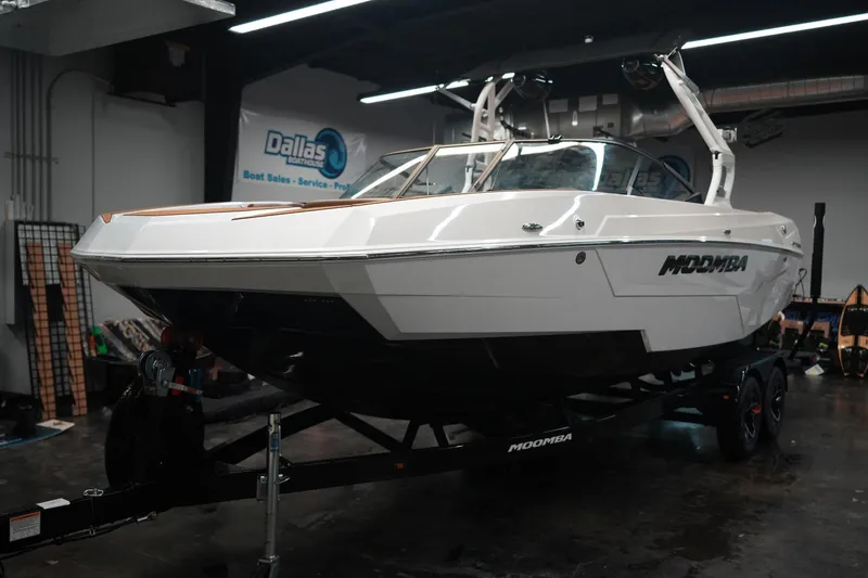 Slide: The Image of 2026 Moomba Tykon boat displayed in a showroom. - 4