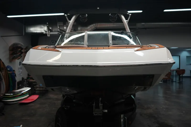 Slide: The Image of 2026 Moomba Tykon boat displayed in a workshop. - 5