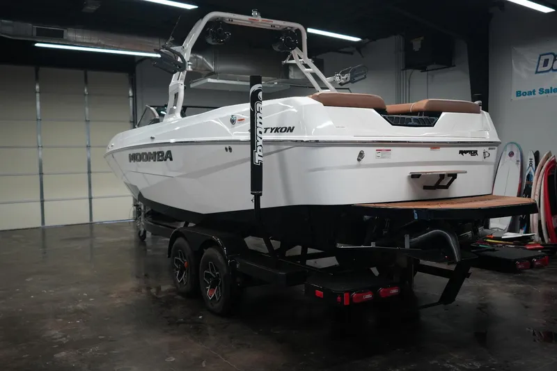 Slide: The Image of 2026 Moomba Tykon boat in showroom on trailer. - 8