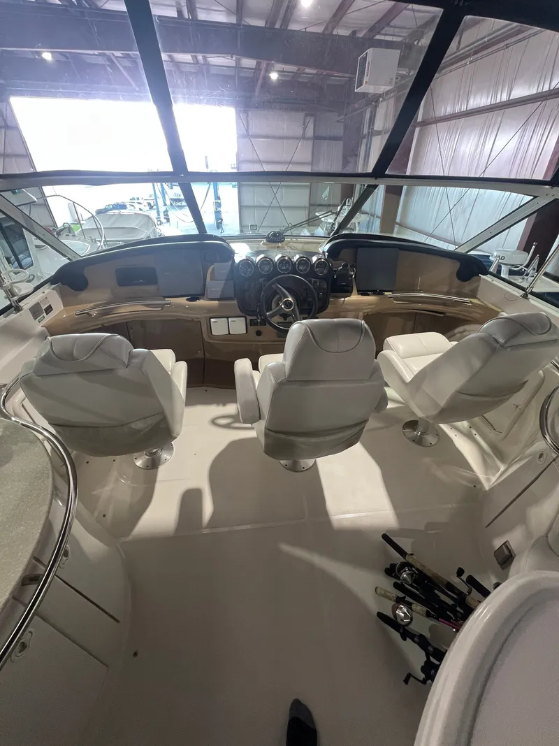 Slide: The Image of Interior of a 2002 Carver 466 Motor Yacht with three white seats. - 13