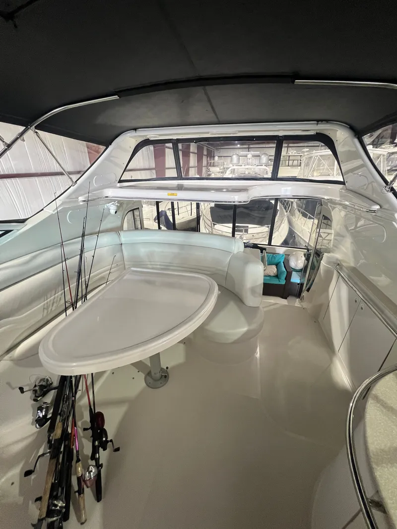 Slide: The Image of Interior of a 2002 Carver 466 Motor Yacht with seating area. - 14