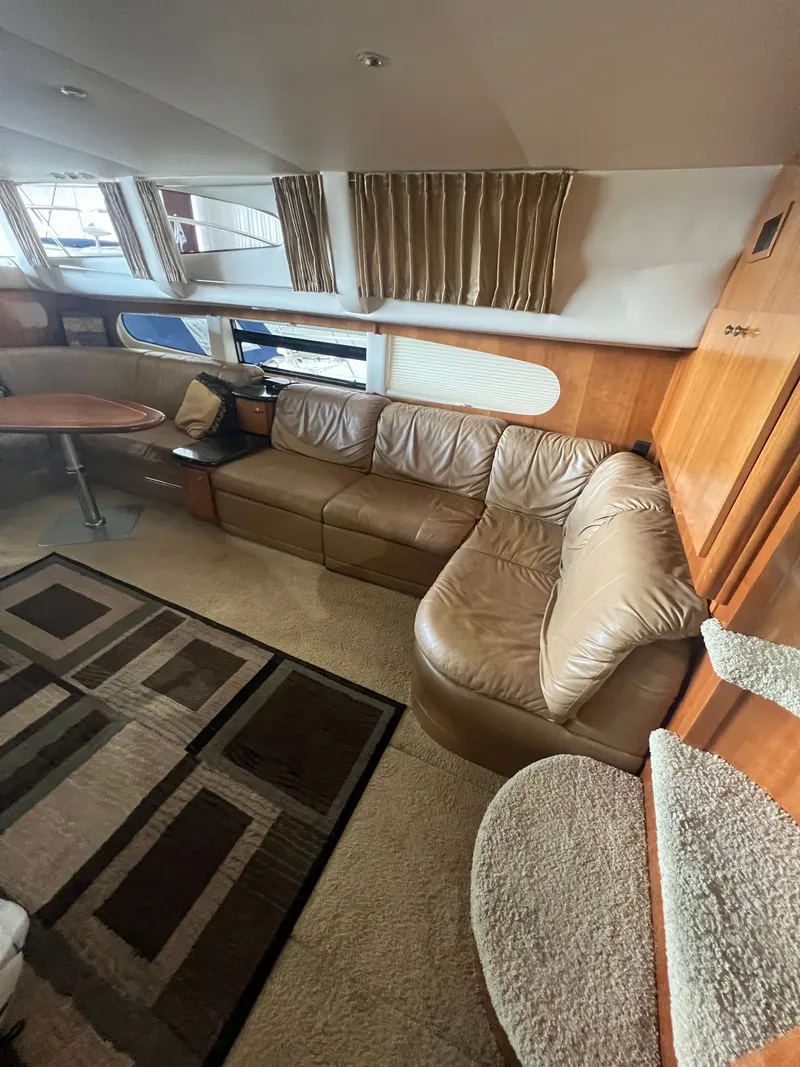 Slide: The Image of Interior of 2002 Carver 466 Motor Yacht with leather sofa and carpet. - 15