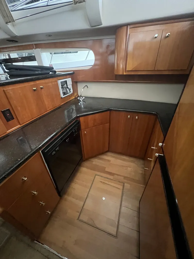 Slide: The Image of Interior of 2002 Carver 466 Motor Yacht featuring elegant kitchen. - 17