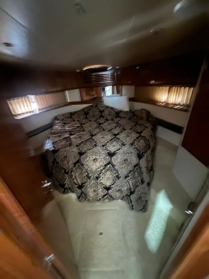 Slide: The Image of Interior of 2002 Carver 466 Motor Yacht with luxurious bed. - 18
