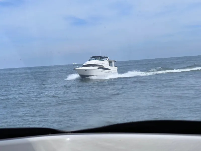 Slide: The Image of Carver 466 Motor Yacht 2002 cruising on open sea. - 2