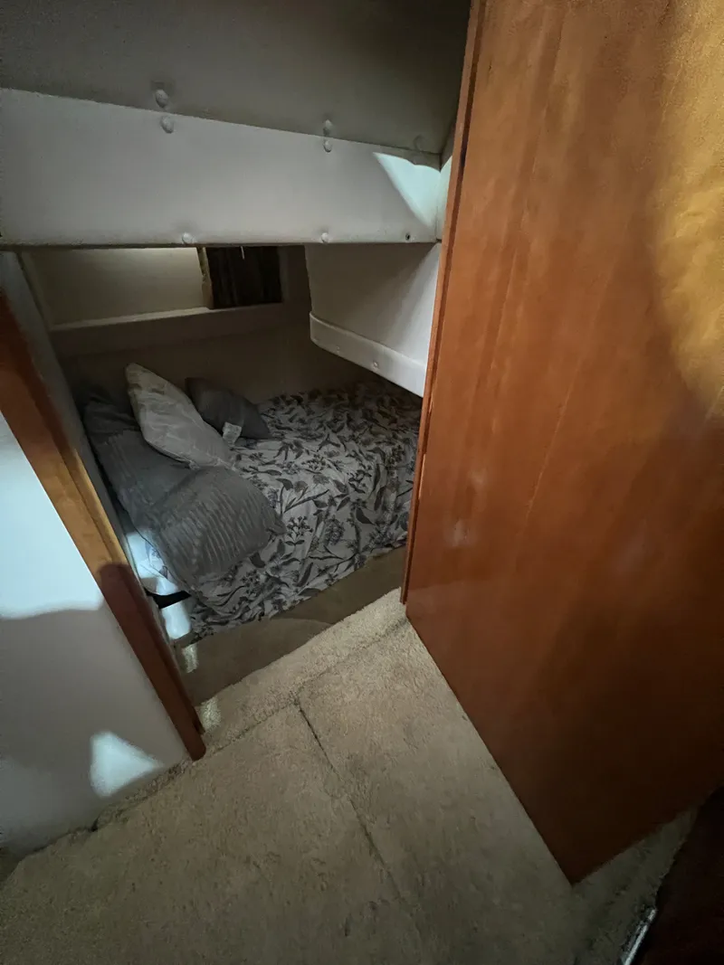 Slide: The Image of Interior of 2002 Carver 466 Motor Yacht with cozy sleeping area. - 20