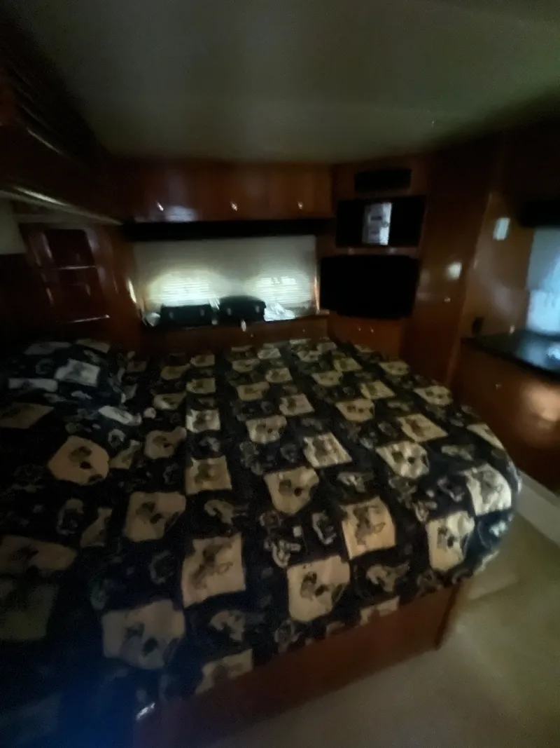 Slide: The Image of Interior of 2002 Carver 466 Motor Yacht with bed and window. - 21