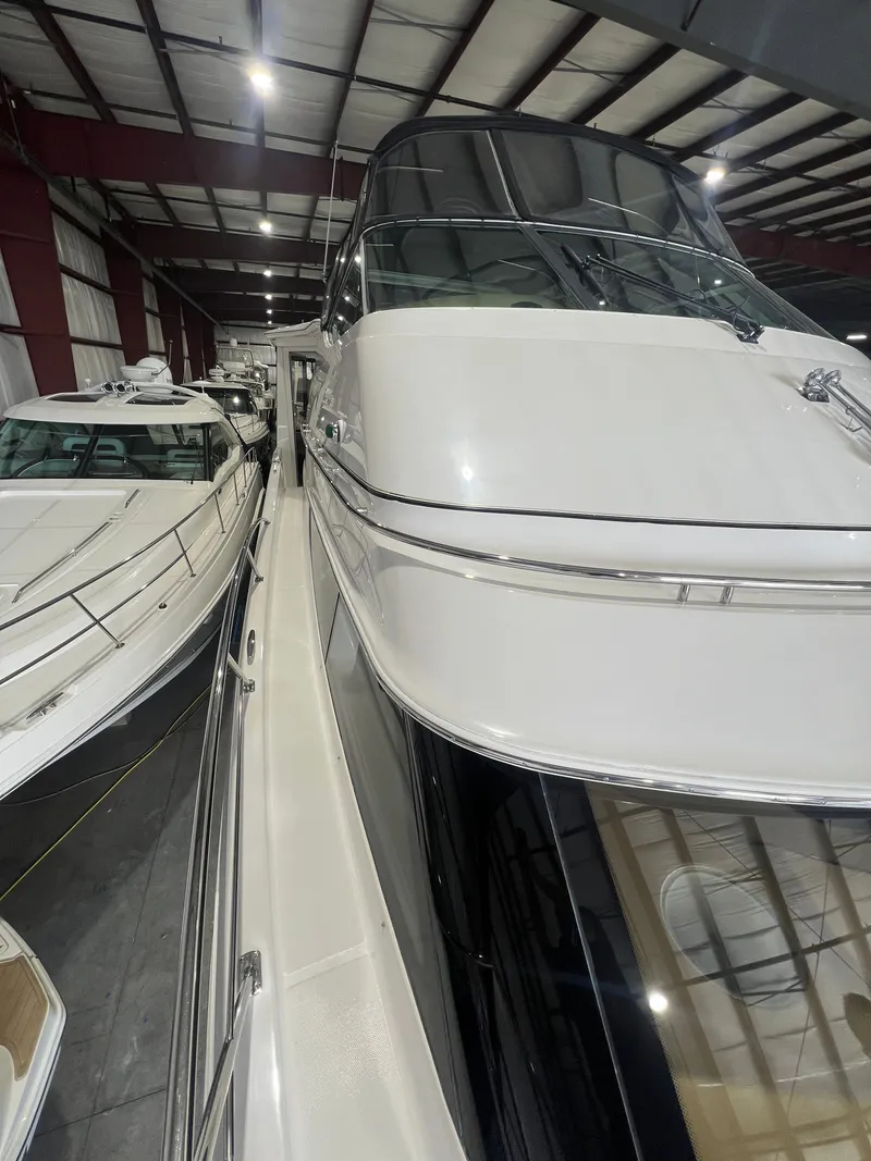 Slide: The Image of 2002 Carver 466 Motor Yacht in a storage facility. - 4