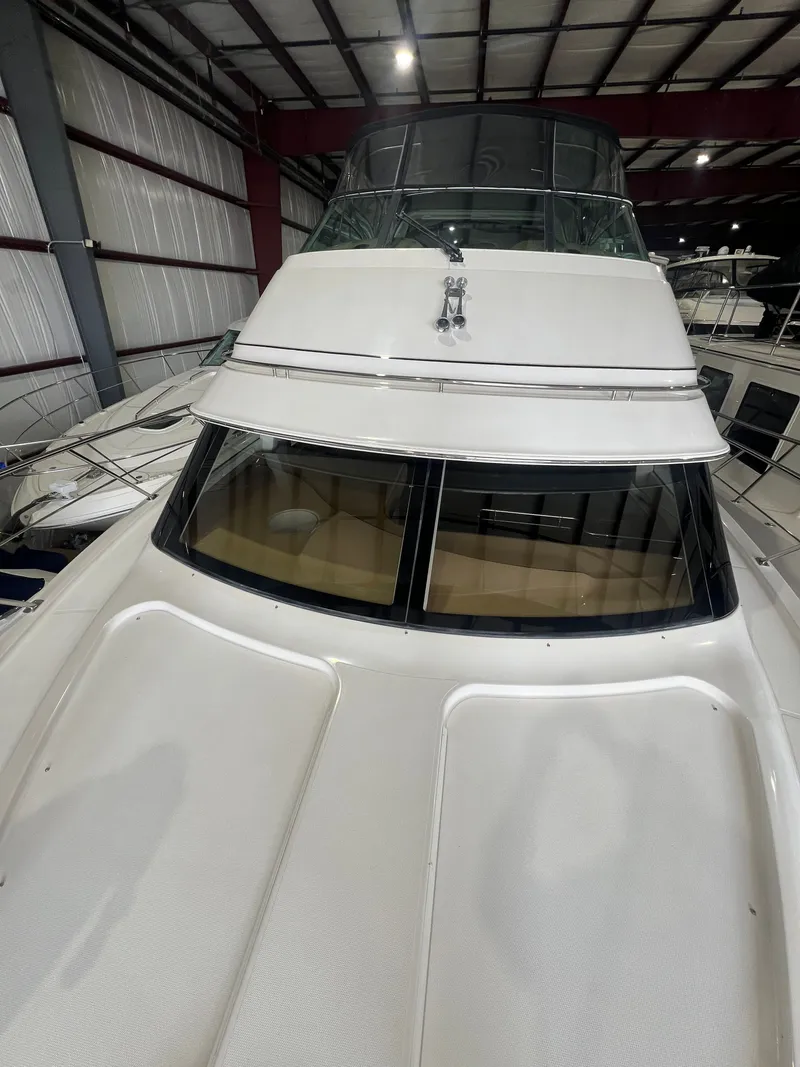 Slide: The Image of 2002 Carver 466 Motor Yacht in a storage facility. - 5