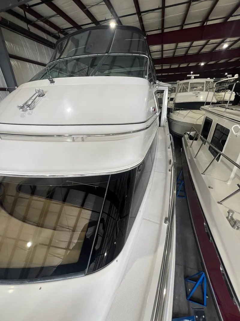 Slide: The Image of 2002 Carver 466 Motor Yacht in a storage facility. - 7