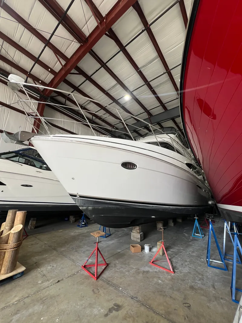 Slide: The Image of Carver 466 Motor Yacht 2002 stored in warehouse on stands. - 8