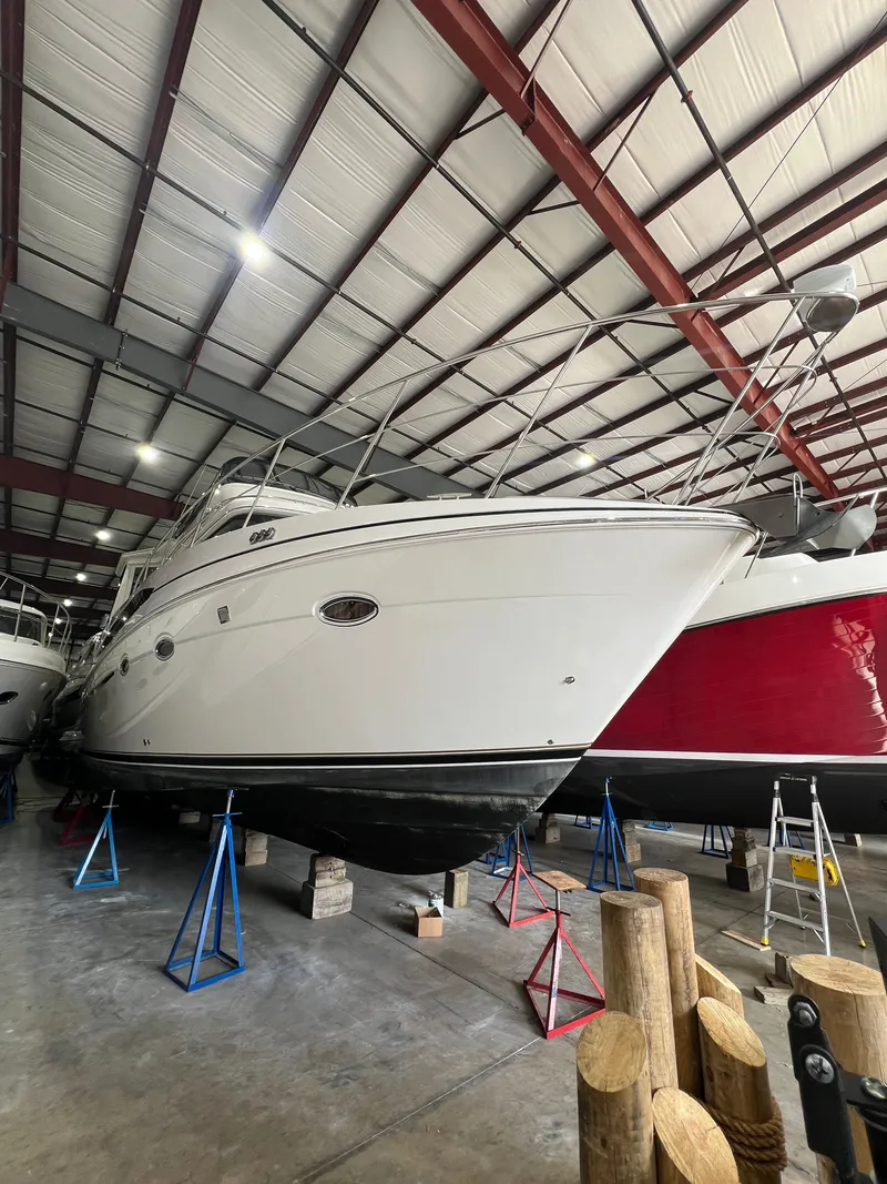 Slide: The Image of 2002 Carver 466 Motor Yacht stored in warehouse on stands. - 9