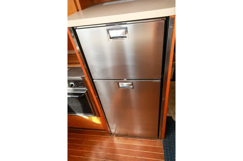 Slide: The Image of Stainless steel sink in 1991 Silverton 41 Aft Cabin yacht kitchen area. - 18