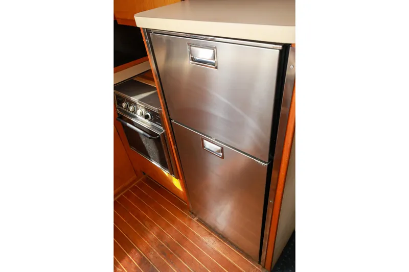 Slide: The Image of Stainless steel refrigerator in 1991 Silverton 41 Aft Cabin yacht kitchen. - 19