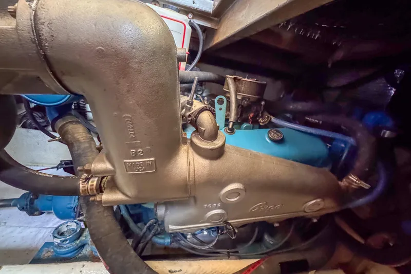 Slide: The Image of Engine room of a 1991 Silverton 41 Aft Cabin boat, showcasing mechanical components. - 39