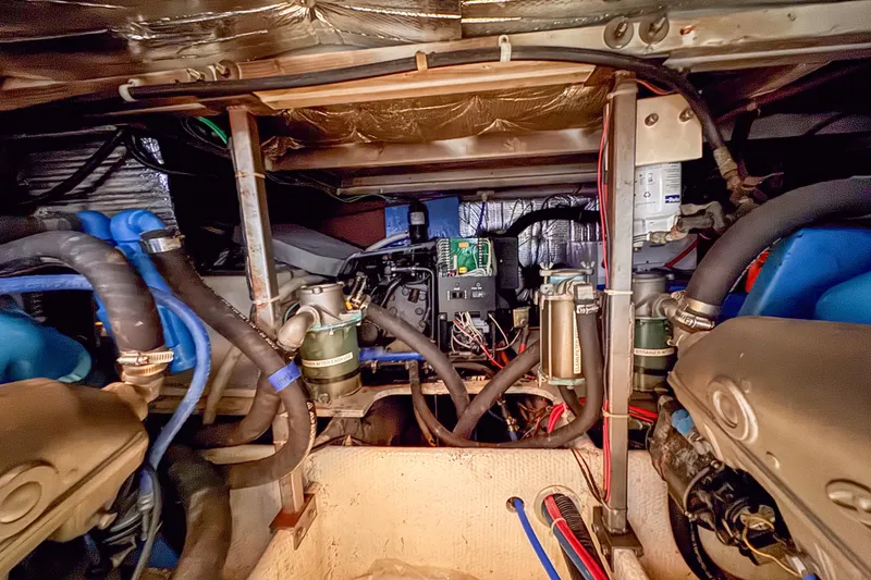 Slide: The Image of Engine compartment of a 1991 Silverton 41 Aft Cabin boat, showcasing mechanical components. - 40