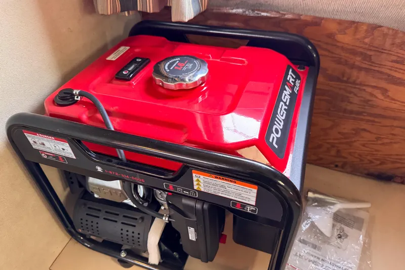 Slide: The Image of PowerSmart generator control panel with 4400 starting watts, 3600 running watts, on a 1991 Silverton 41 Aft Cabin. - 42