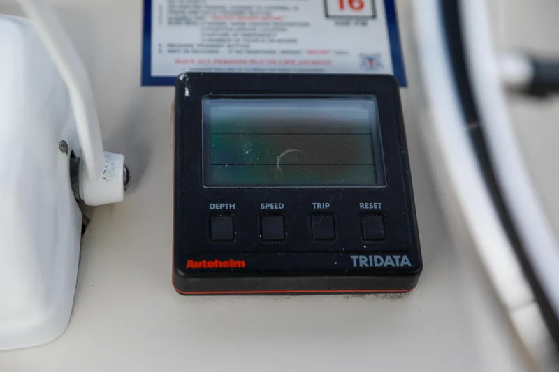 Slide: The Image of Autohelm Tridata display on 1991 Silverton 41 Aft Cabin, showing depth, speed, and trip functions. - 49