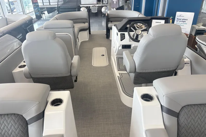 Slide: The Image of Interior of 2026 Crest 230 SLRC Caribbean boat with luxurious seating and modern helm. - 10