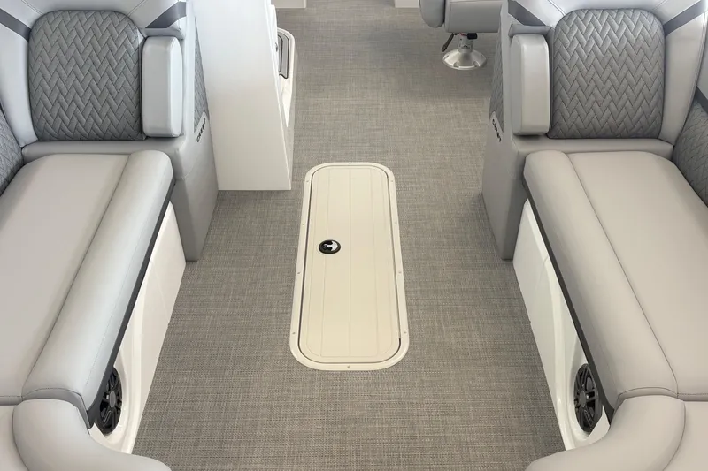 Slide: The Image of Interior of 2026 Crest 230 SLRC Caribbean boat with gray seating and carpeted floor. - 12