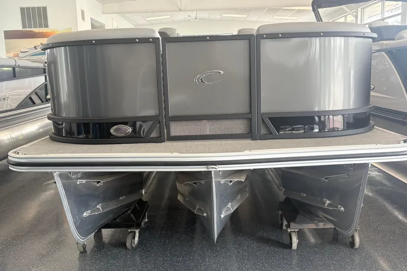 Slide: The Image of 2026 Crest 230 SLRC Caribbean pontoon boat in showroom, front view. - 4