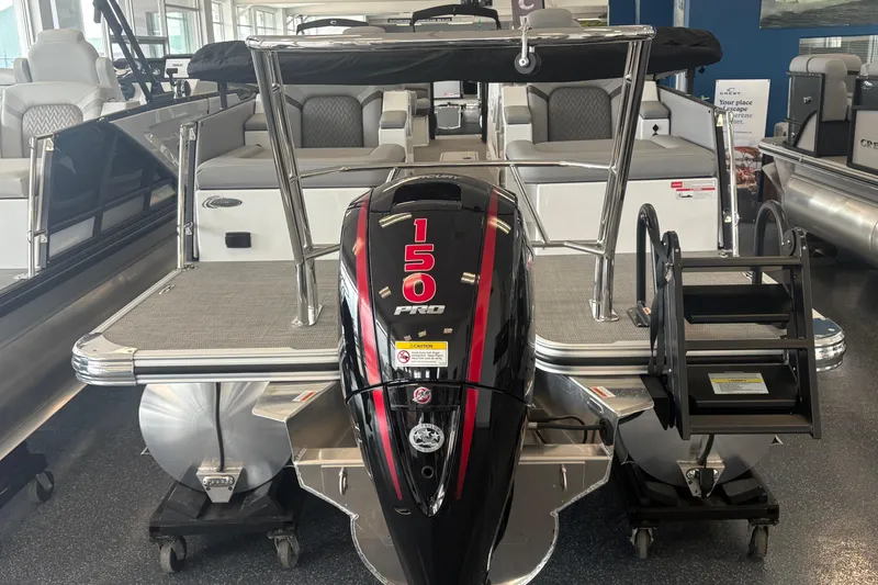 Slide: The Image of 2026 Crest 230 SLRC Caribbean pontoon boat with 150 Pro motor in showroom. - 5