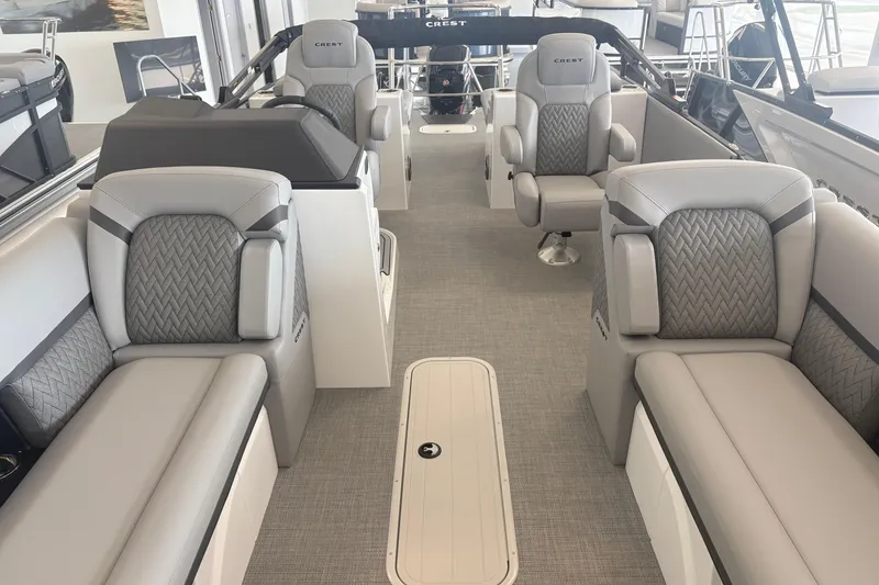 Slide: The Image of Luxurious interior of 2026 Crest 230 SLRC Caribbean pontoon boat with plush seating. - 9