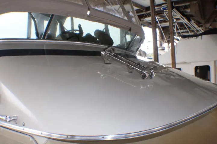 Slide: The Image of 1988 Tollycraft 30 Sport Cruiser boat deck with windshield and anchor. - 3