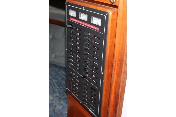 Slide: The Image of Electrical panel on 1988 Tollycraft 30 Sport Cruiser, featuring switches and gauges. - 50